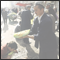 Salesman offers watermellon to taste at the sunday bazaar. Kashgar, Xinjiang, CHN