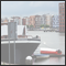 New residential area with modern architecture in the old eastern harbour Java and in the foreground a typical houseboat. Amsterdam, NLD