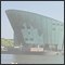 Like the bow of a containership rises the New Metroplis Museum into the harbour-basin. Amsterdam, NLD 